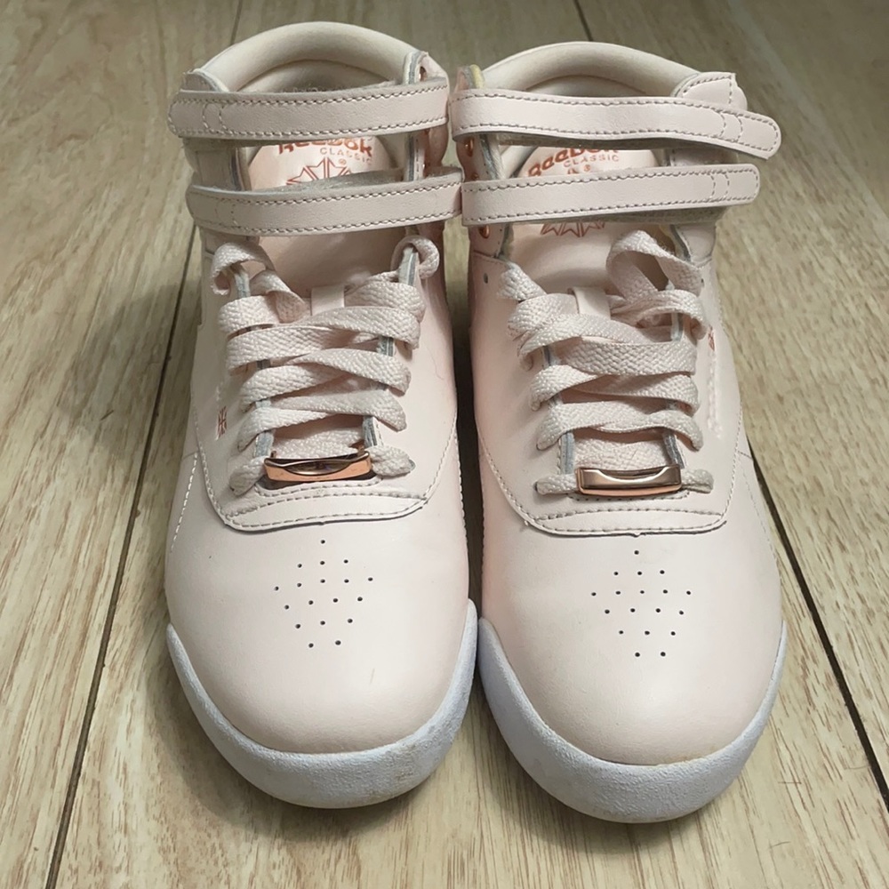 Reebok Freestyle High Top Sneakers in blush.